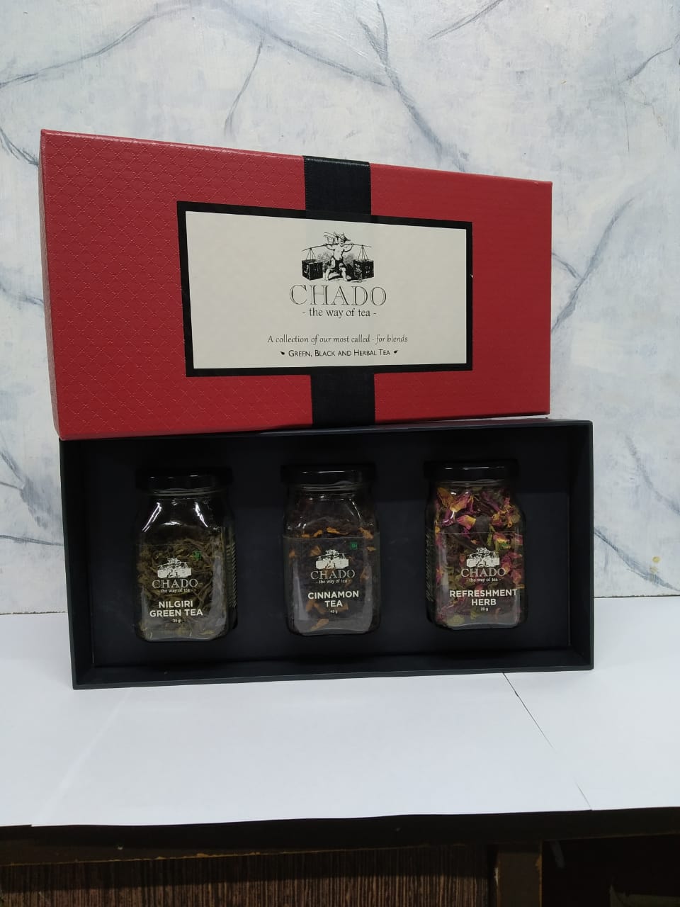 Red & Black Box With Glass Bottles