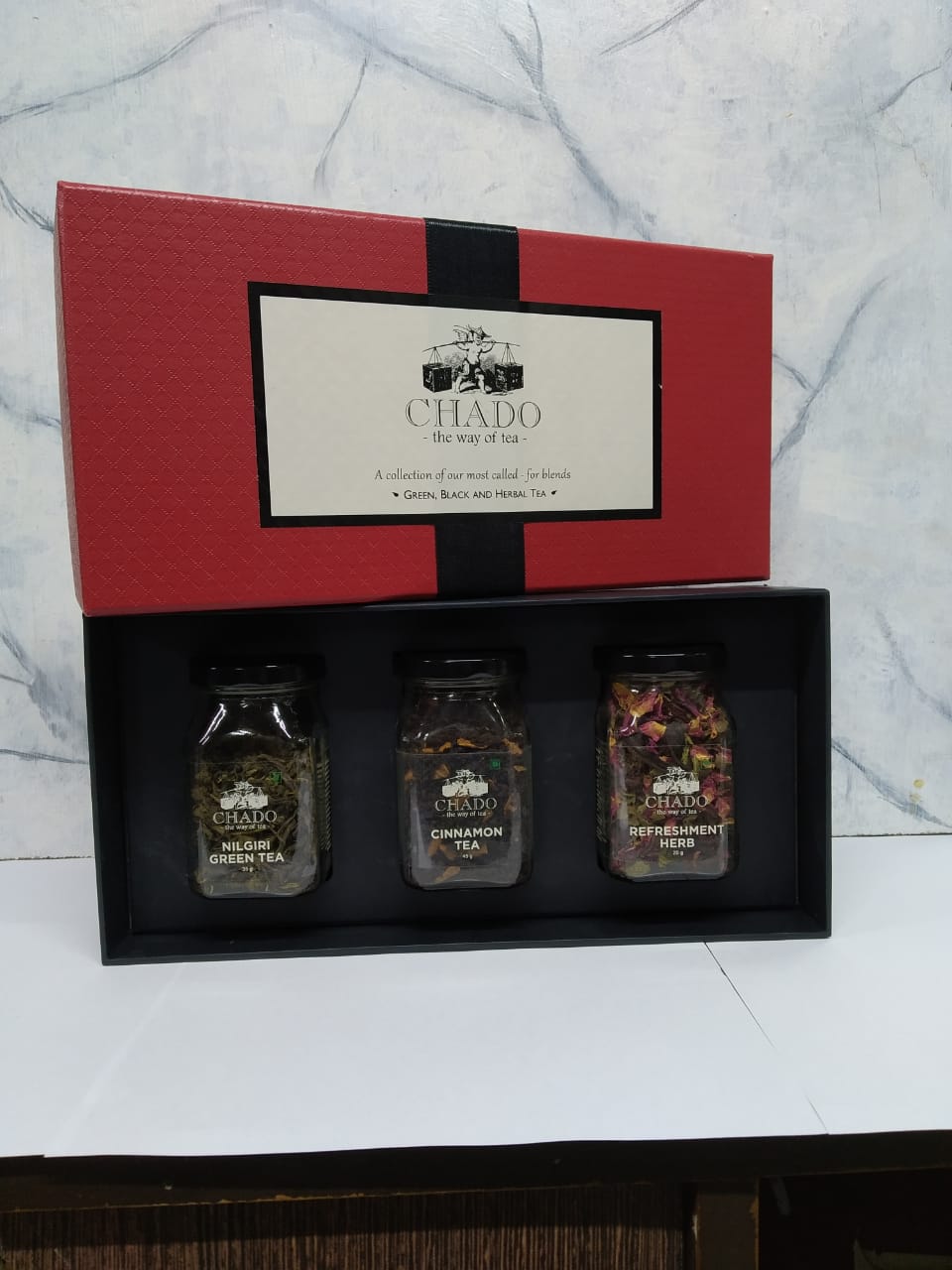 Red &amp; Black Box With Glass Bottles